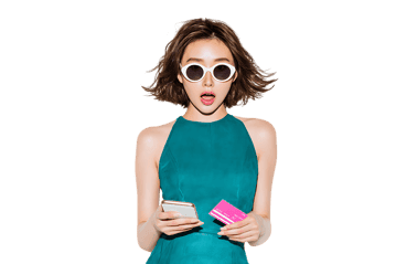 Surprised woman looking at her smartphone and credit card.