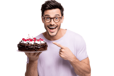 Man with glasses shows off chocolate cake