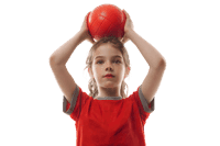 Girl in red shirt holding red ball above head