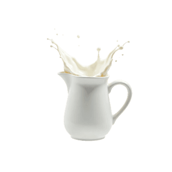 Milk splashing from pitcher, dairy drink