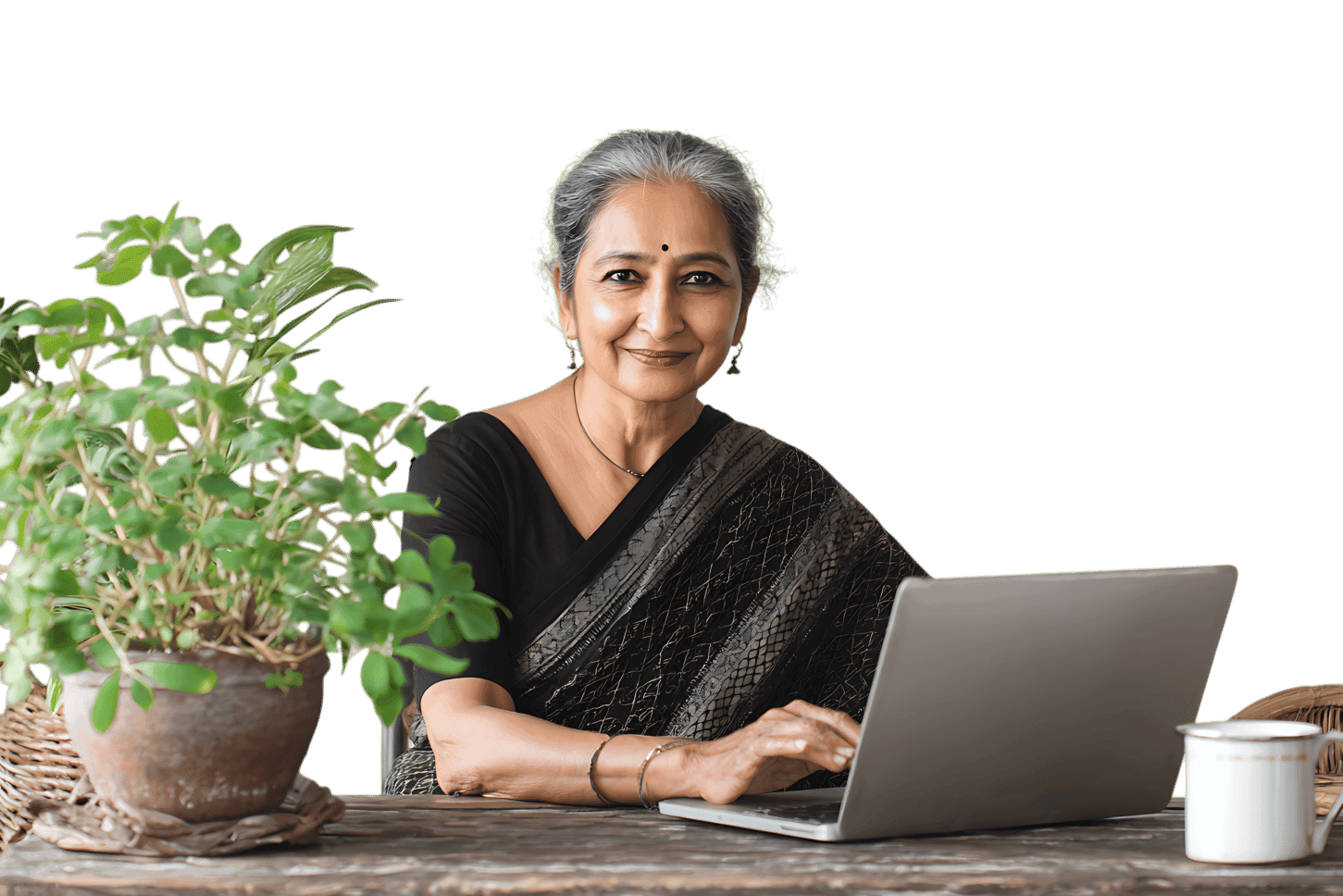 Smiling senior woman using laptop, plants nearby
