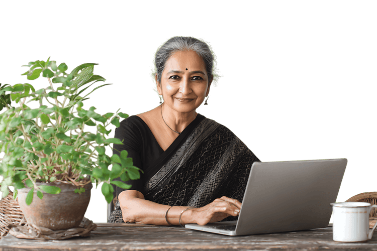 Smiling senior woman using laptop, plants nearby
