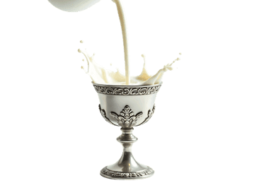 Milk pouring into silver goblet with splash
