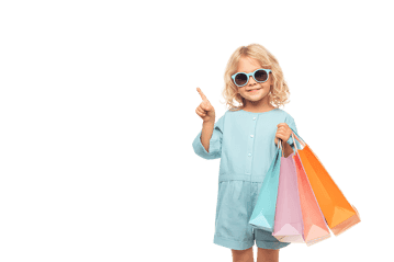 Adorable toddler girl with shopping bags, pointing upwards.