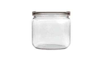 Empty glass jar isolated on black background