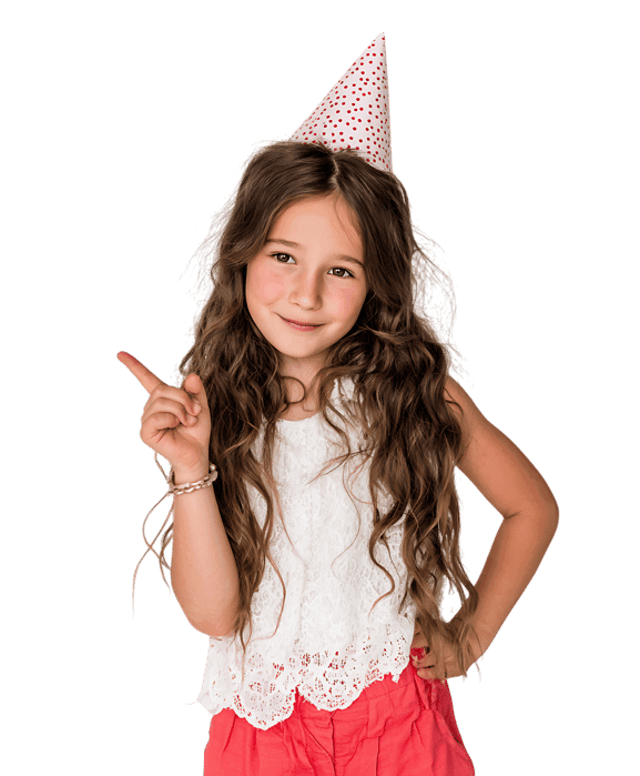 Adorable girl in party hat points.