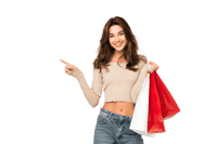 Smiling woman with shopping bags, pointing to the side.