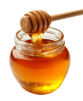 Golden honey flows from a wooden dipper.