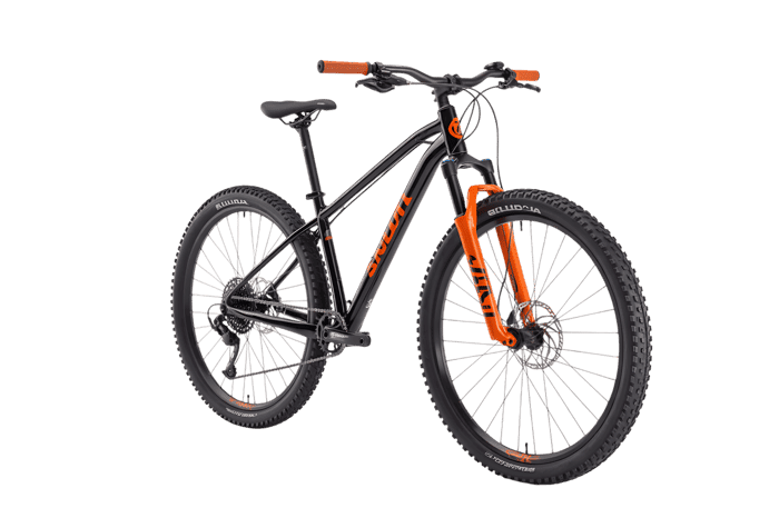 Black mountain bike with orange fork and handlebar grips