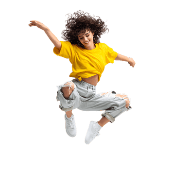 Young woman expressing freedom and happiness through a dynamic jump.