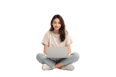 Young woman using laptop, sitting cross legged.