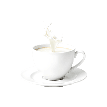 White ceramic coffee cup and saucer with milk splashing out, creating dynamic motion on white background992