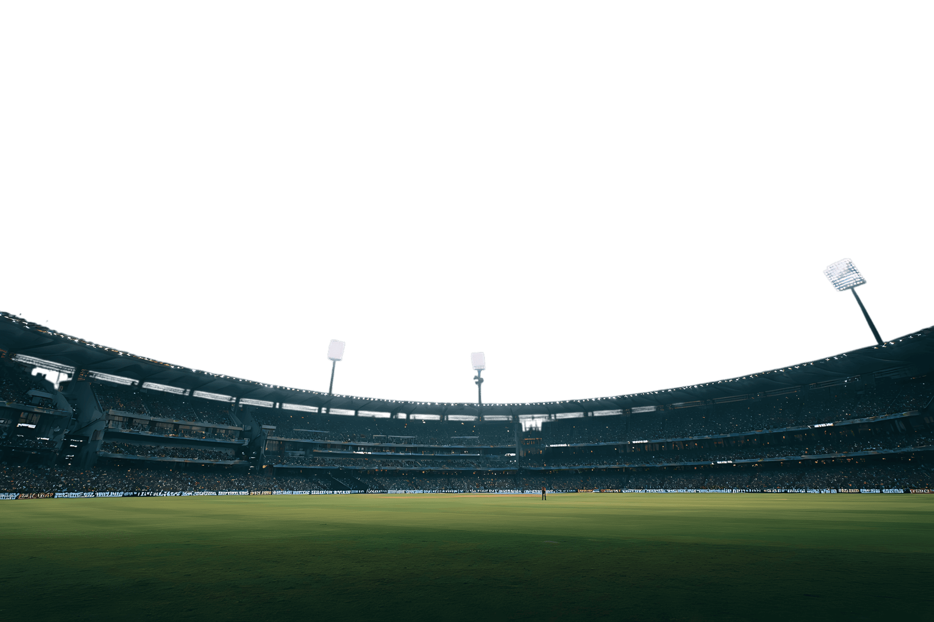 Night view of an empty stadium under floodlights.