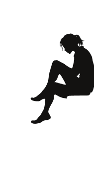 Silhouette of a person sitting alone in contemplation
