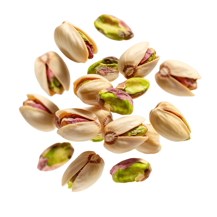Falling pistachios, isolated on white background