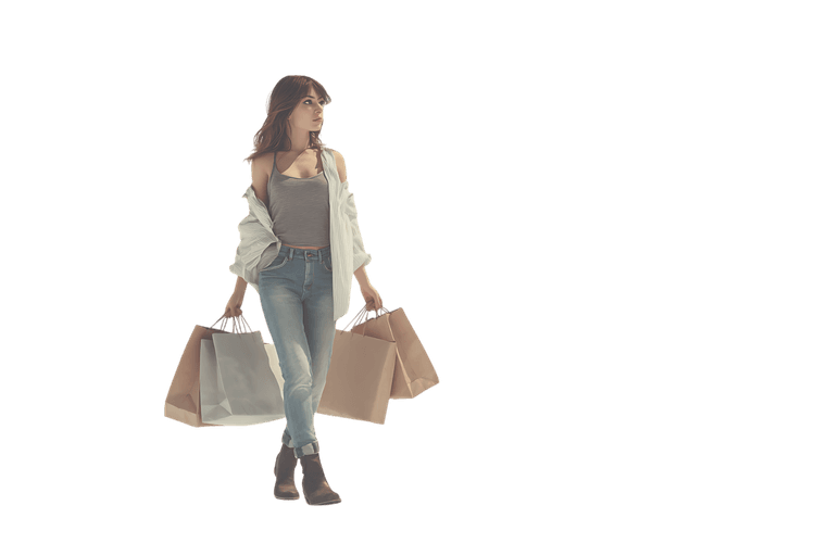 Young woman carrying shopping bags after shopping.