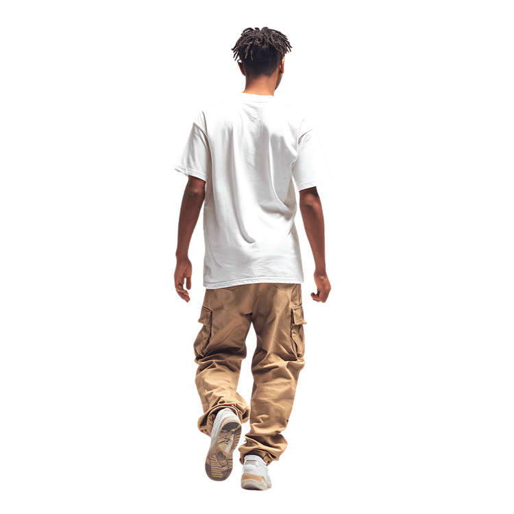Man in white t shirt and cargo pants walking away. Rear view.