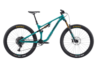 Teal mountain bike for extreme sports and outdoor recreation