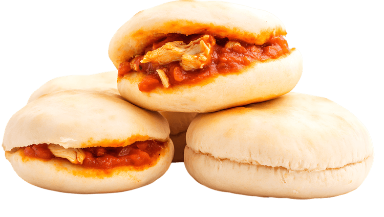 Delicious mini pizzas with chicken and tomato sauce.