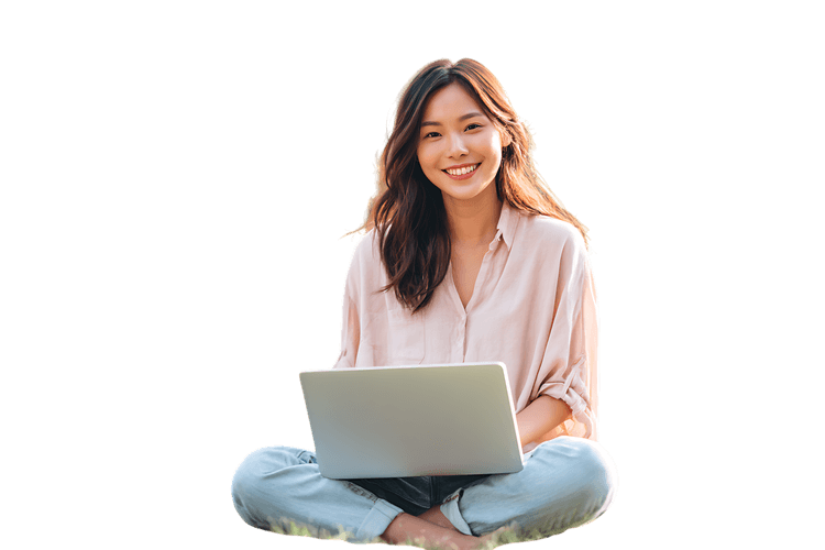 Smiling woman working on laptop outdoors
