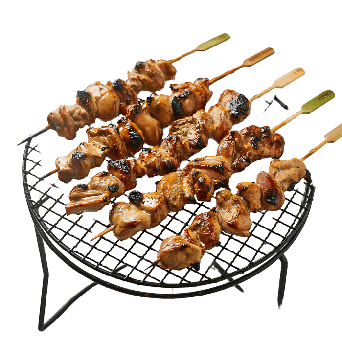 Delicious grilled chicken skewers on a barbecue grill.