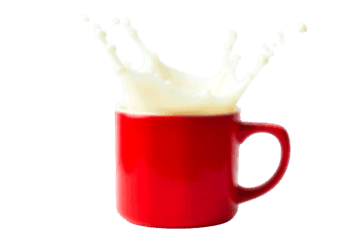 White milk splashing out of a vibrant red ceramic mug against a white background, creating a dynamic contrast724