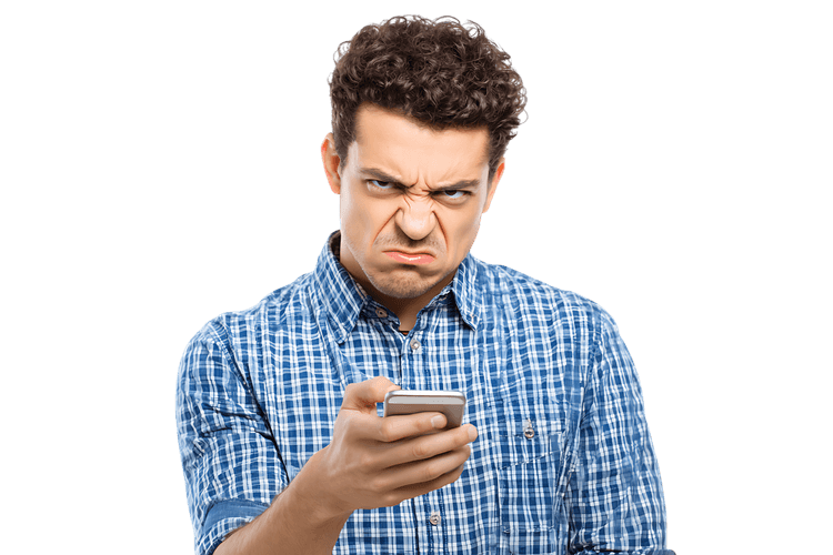 Angry man looking at his smartphone.