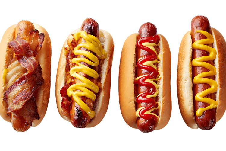 Four delicious hot dogs with various toppings.