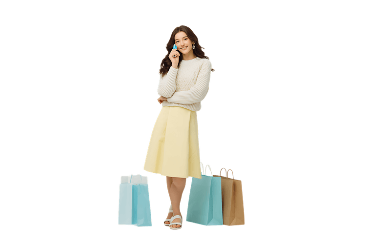 Smiling woman on phone, next to shopping bags. Online shopping, retail, consumerism concept.