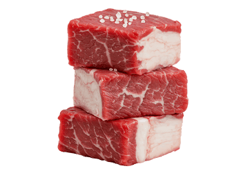 Stack of fresh beef cubes, seasoned with salt.