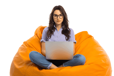 Young woman using laptop relaxing in orange bean bag chair