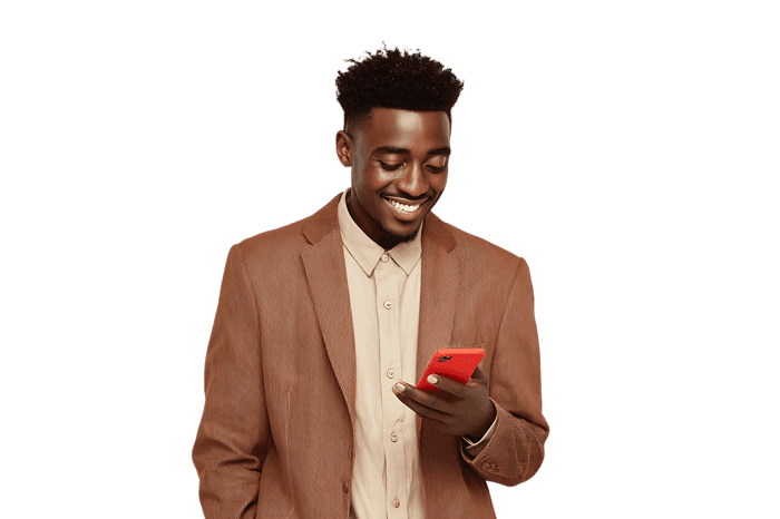Smiling man in brown blazer using smartphone