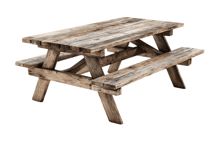 Weathered wooden picnic table, perfect for outdoor settings.