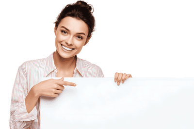 Smiling woman pointing at blank sign.  Perfect for advertisement.