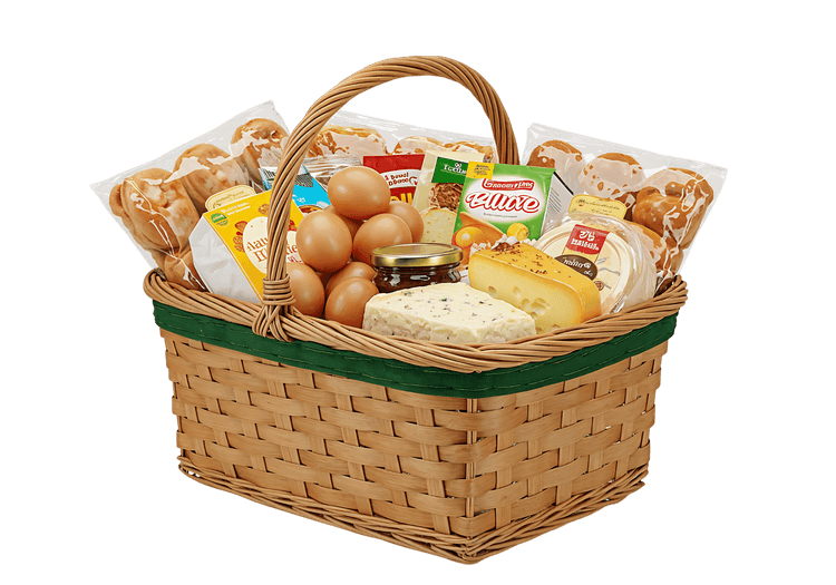 Full wicker basket of groceries, eggs, cheese, bread.