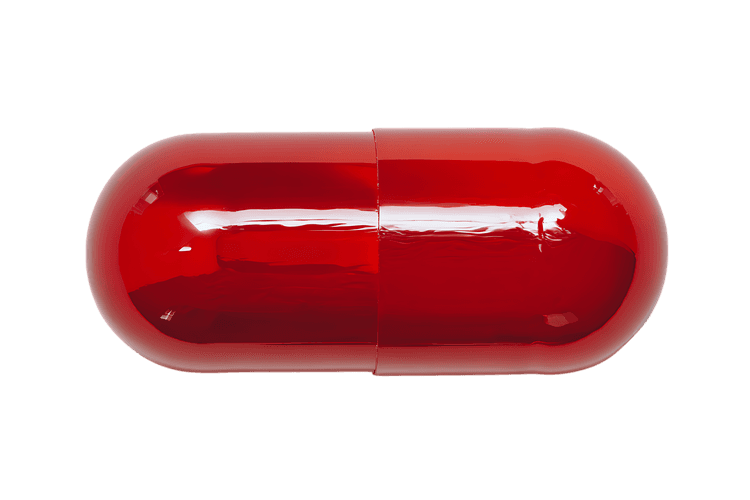Close up of a single red capsule pill isolated on black background.