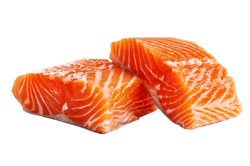Two fresh salmon fillets on black background
