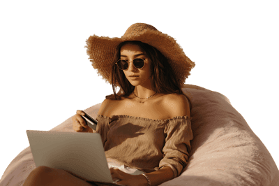 Woman online shopping from a beanbag chair.