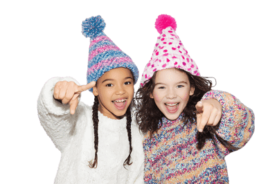 Two girls point playfully! Winter fun!