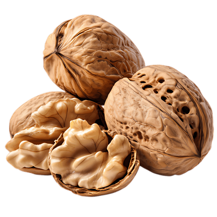 Close up of walnuts, one cracked open.