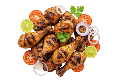 Delicious grilled chicken legs with tomatoes, onions, and lime.