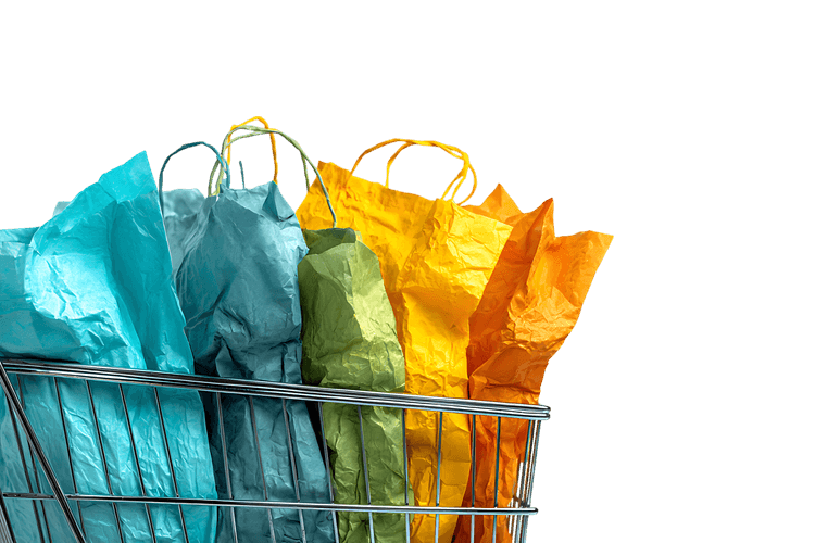 Colorful shopping bags in a shopping cart