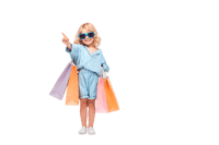 Cute girl with shopping bags, pointing. Retail, shopping, consumerism concept.