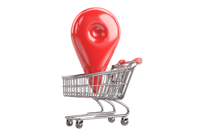 Red map pointer in shopping cart. Location based shopping concept.