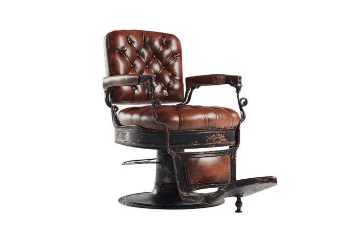 Vintage barber chair, brown leather, isolated on black.