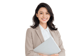 Smiling businesswoman holding a laptop