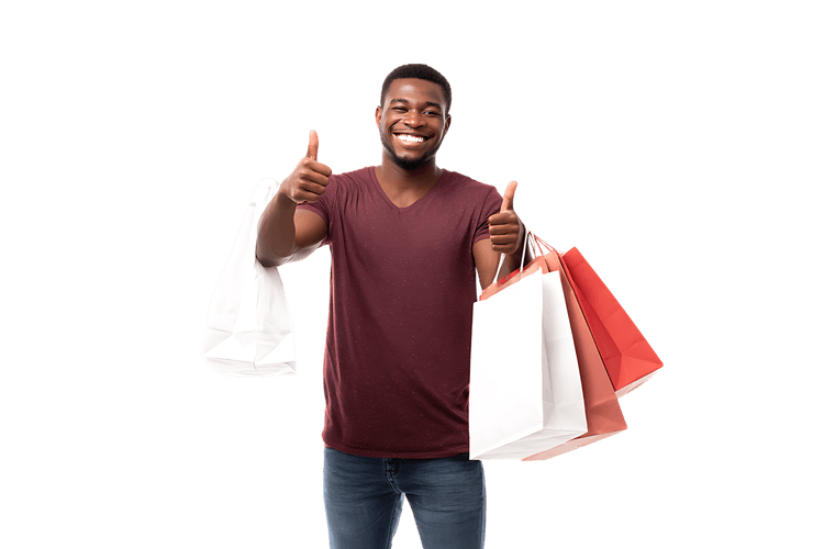 Happy man with shopping bags giving thumbs up