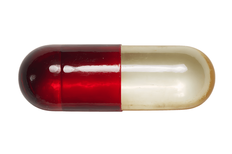 Red and beige capsule pill