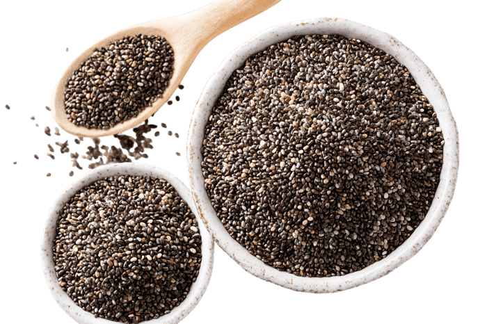 Chia seeds in bowls and wooden spoon. Healthy food concept.