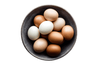 A bowl of brown and white eggs.